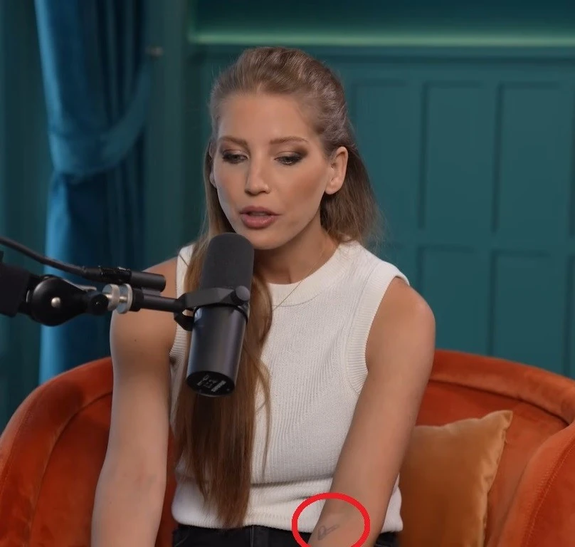 Szabó Zsófi bal alkarján még ott a Shane Tusuppal közös tetoválás (Fotó: YouTube/InStyle)